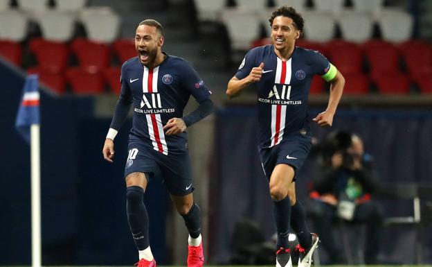 Marquinhos runs to hug Neymar, after a goal by the Brazilian striker for PSG.