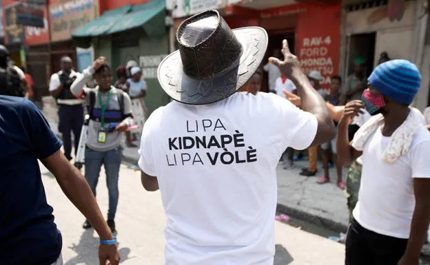 Protest against the kidnapping of the 17 North American religious in Haiti.