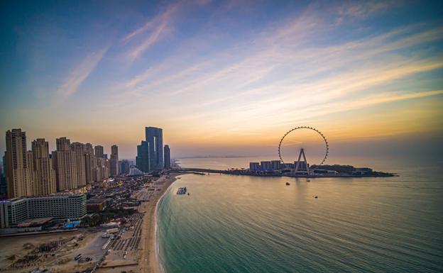 Beaches and attractions such as the new Ferris wheel await tourists in Dubai. 