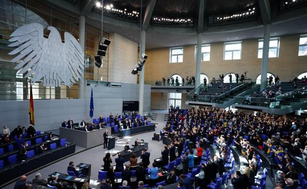 German Chancellor Olaf Scholz receives a standing ovation during a government statement in the German 'Bundestag' parliament.