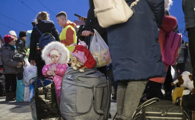 Mass exodus.  Thousands of women and children cross Ukraine's border with Poland through the Medyka Pass to flee shelling.