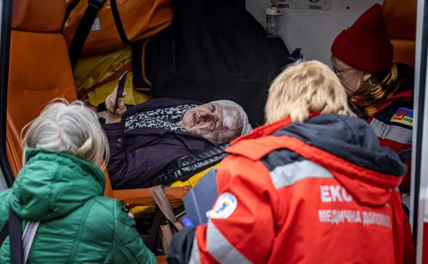 Ambulance transfer of a woman injured during the Russian bombing in kyiv. 