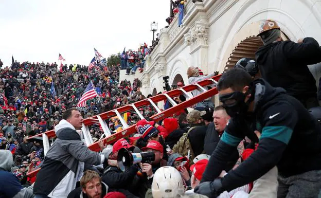 Trump supporters force their way into the Capitol on January 6, 2021.