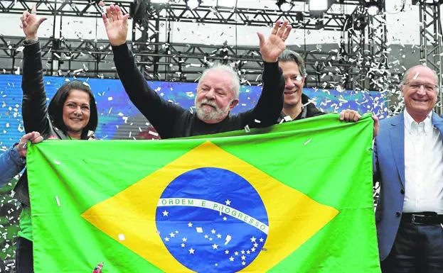 Lula greets supporters during a campaign rally in the Vale do Anhangabaú in downtown Sao Paulo. 