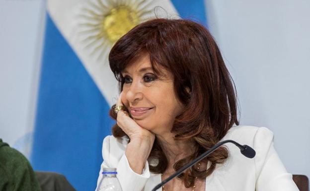 Vice President Fernández de Kirchner reappears at a Senate meeting with a group of priests. 
