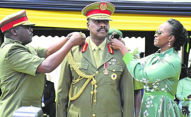 Muhoozi Kainerugaba, with his wife, Charlotte Nakunda, at the imposition of his fourth star as a general of the Ugandan Army. 