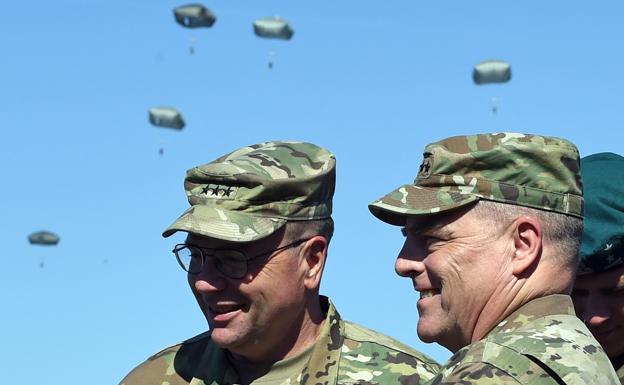 General Ben Hodges, left, talks with his counterpart Mark Milley during military exercises in Poland in 2018. 