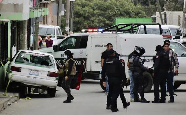 Police inspect the crime scene where the Mexican journalist Pedro Pablo Kumul was murdered, in Veracruz. 