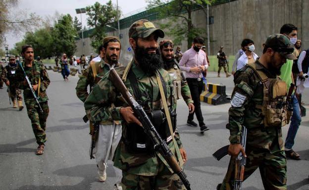 Taliban security forces patrol the Kabul neighborhood. 
