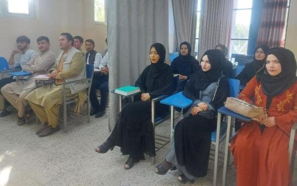 Men and women study separately in a class at Kabul University. 
