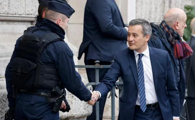 French Interior Minister Gérald Darmanin greets a security guard during an event held last Sunday in Paris.